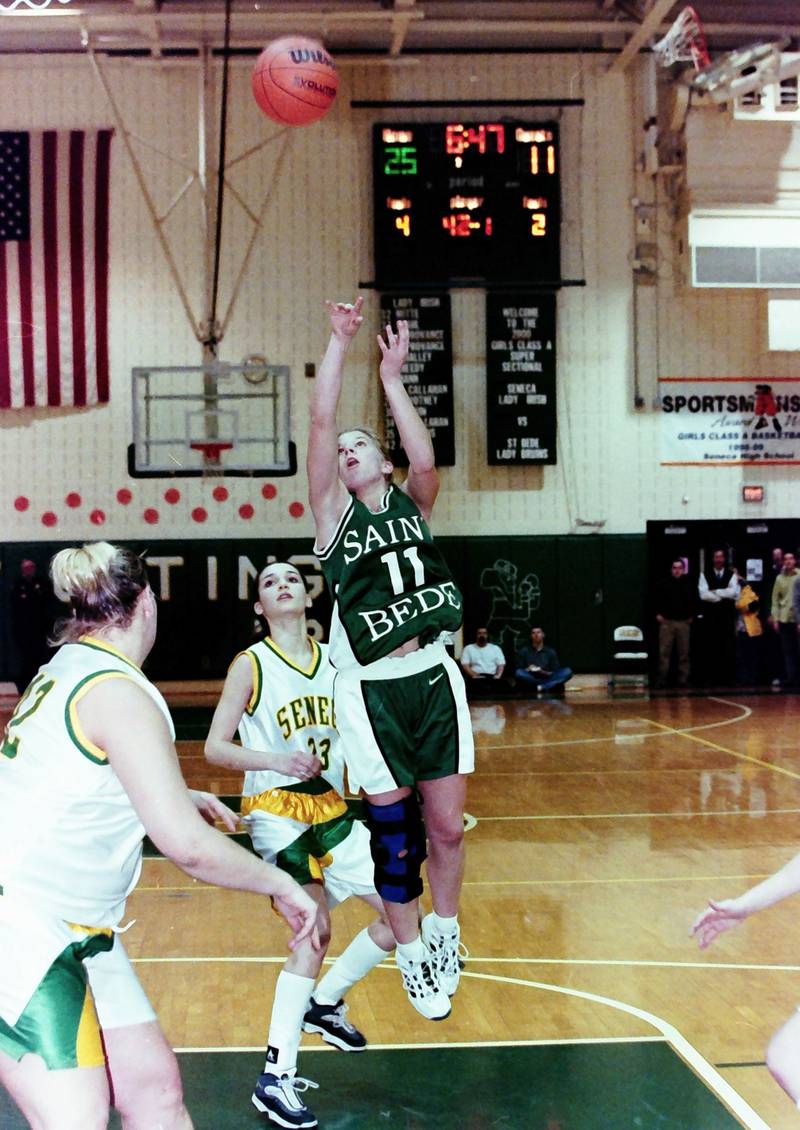 St. Bede's Karisa Dinges shoots a jump shot over Seneca players during the Supersectional game on Feb. 21, 2000.