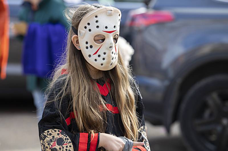 Channeling her inner Jason, Jordyn Leverenz, 10, of Sterling stalks her candy prey Saturday, Oct. 28, 2023 during Dixon’s Treat Street trick of treating event.