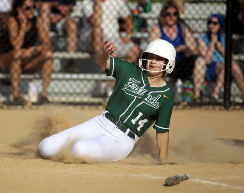 Fremd’s Claire Kanupke slides into home base during a Class 4A St. Charles North Sectional semifinal against St. Charles North on Tuesday, May 30, 2023.