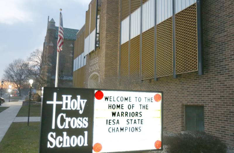 A sign reads "welcome to the home of the Warriors IESA State Champions" on Tuesday, Feb. 20, 2024 at Mendota Holy Cross School. The team beat Pana Sacred Heart 41-33 to win the IESA Class 1A State championship.