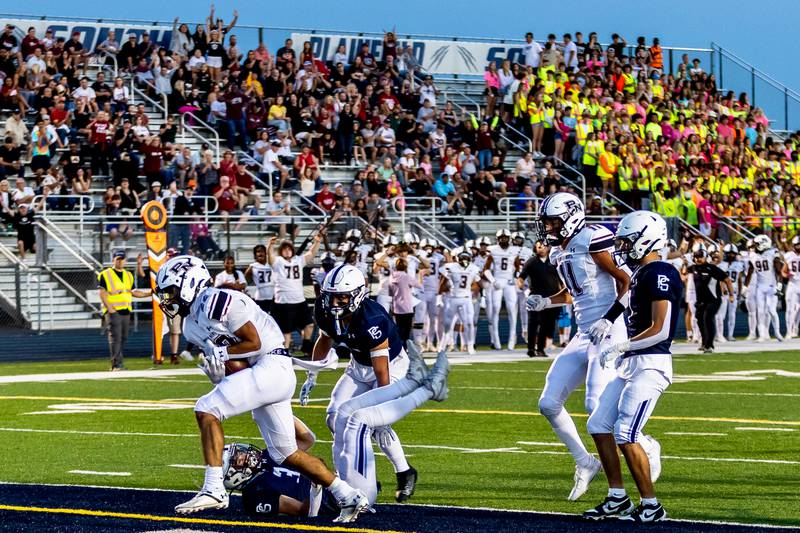 Plainfield North's Malik Jassim scores a touchdown against Plainfield South on Sept. 13, 2024.