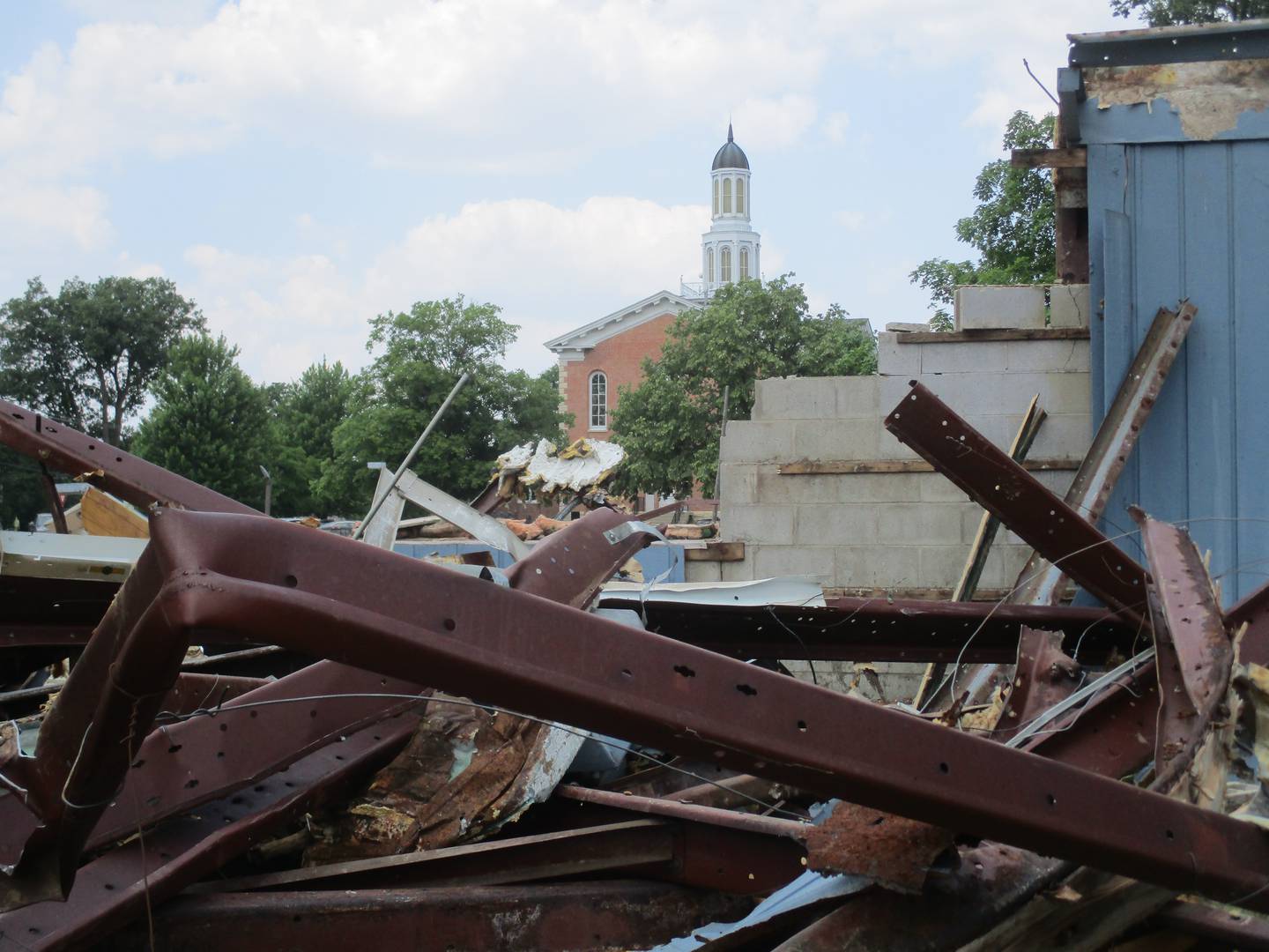 The building demolition on June 22, 2023 has opened up a new vista, providing a view of the Historic Kendall County Courthouse in the distance.