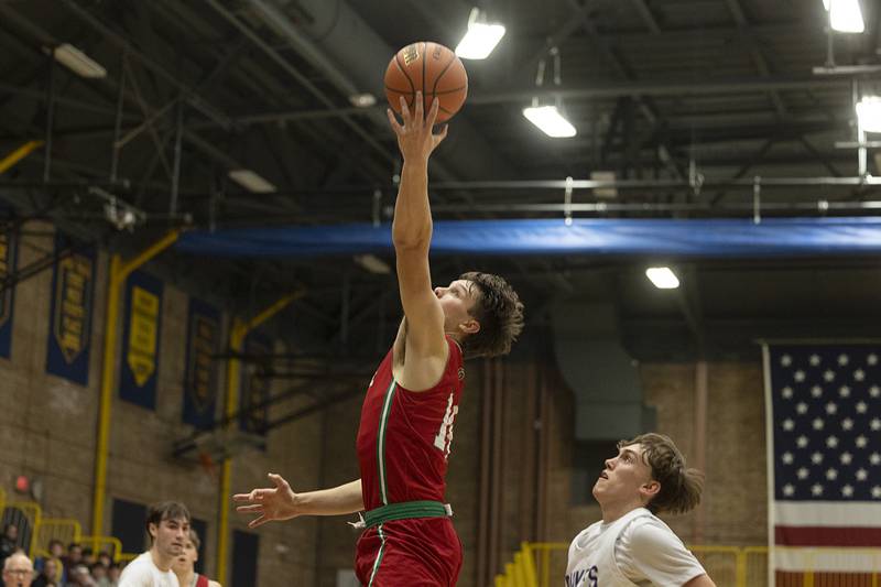 LaSalle-Peru’s Brendan Boudreau reaches for a pass against Dixon Wednesday, Feb. 21, 2024 at the Sterling class 3A basketball regional.