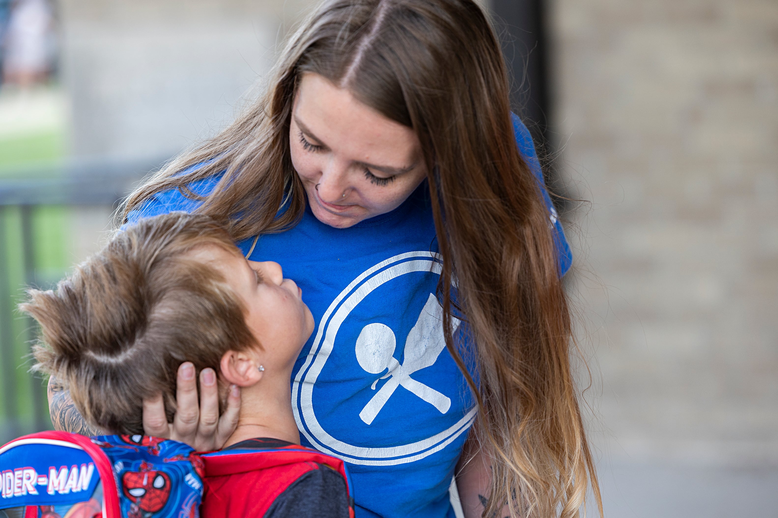 Chelsea Brodnax gets a kiss goodbye from son John Wednesday, Aug. 14, 2024 at Washington School in Dixon. Kids throughout the Sauk Valley went back to school Wednesday after the summer break.