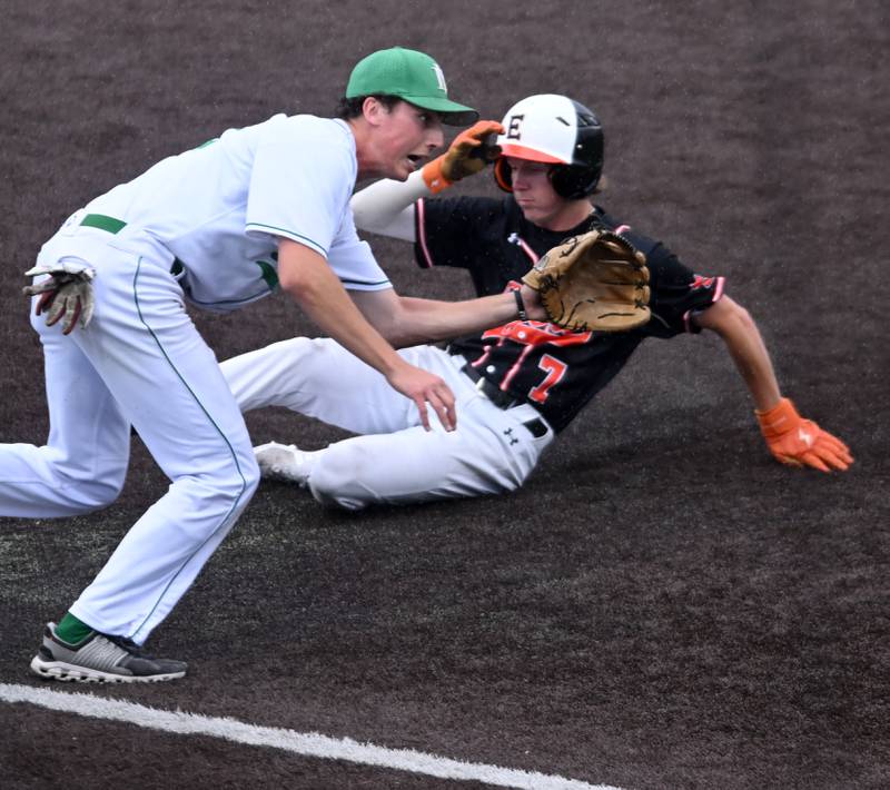 York’s Paul Reedy takes the throw at third base as Edwardsville's Logan Porter slides into the bag with a steal during the Class 4A state baseball third-place game at Duly Health and Care Field on Saturday, June 8, 2024 in Joliet.