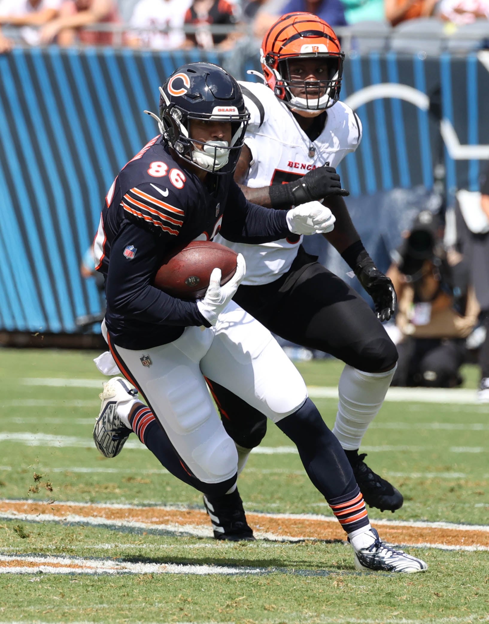 Chicago Bears wide receiver Freddie Swain is brought down by a pair of Cincinnati Bengals after a catch during their game Saturday, Aug. 17, 2024, at Soldier Field in Chicago.