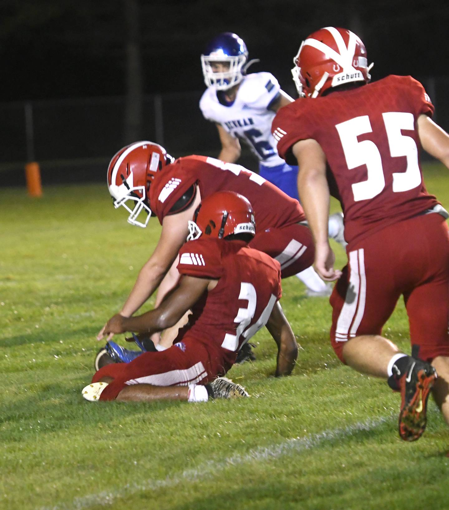 Morrison's Evan McDonnell picks up a fumble during action against Newman on Friday, Aug. 26, 2022.