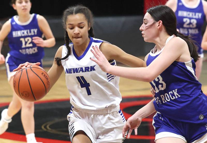 Newark’s Kiara Wesseh pushes the ball up court against Hinckley-Big Rock's Mia Cotton Thursday, Jan. 18, 2024, during the Little 10 girls basketball tournament at Indian Creek High School in Shabbona.