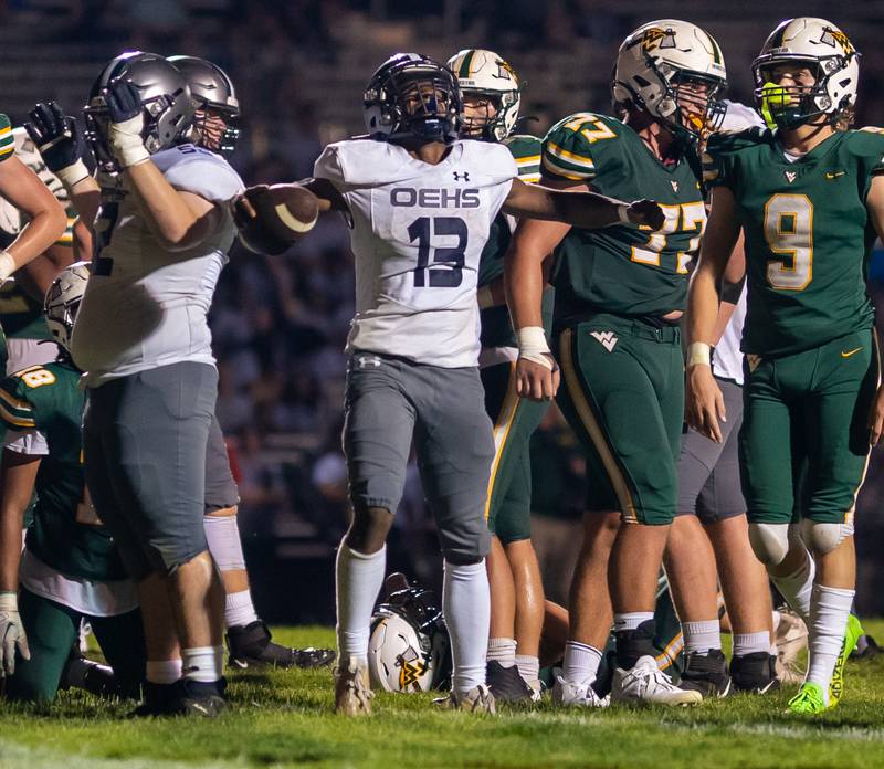 Oswego East's Jasiah Watson (13) reacts after scoring a touchdown against Waubonsie Valley during a football game at Waubonsie Valley High School in Aurora on Friday, Aug. 25, 2023.