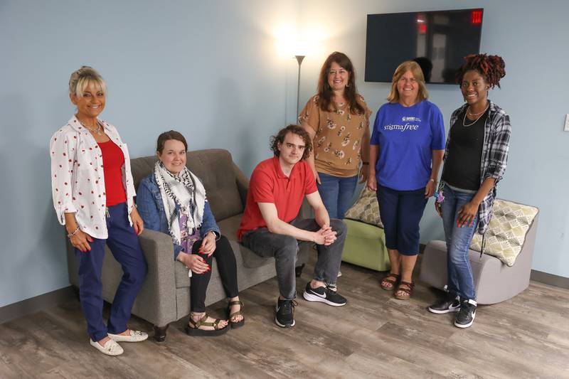 The Living Room in Joliet staff, left, Victoria Menard, Alexandria Springer, Luke Johnson, Rachel Evans, Teena Mackey and Tamara Smith pose for a photo on Wednesday, May 15, 2024 in Joliet.