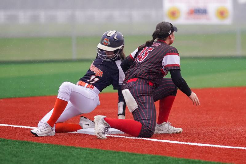 Oswego’s Kaylee LaChappell (11) slides into third beating the tag by Yorkville's Regan Bishop (15) during a softball game at Yorkville High School on Thursday, May 9, 2024.