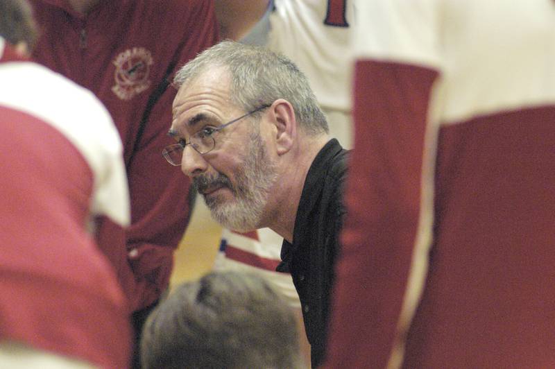 Morrison Head Coach Mark Ernst talks to his team at a timeout during the Morrison vs Princeton class 2A basketball regional final at Prophetstown High School on Friday, Feb. 23 .