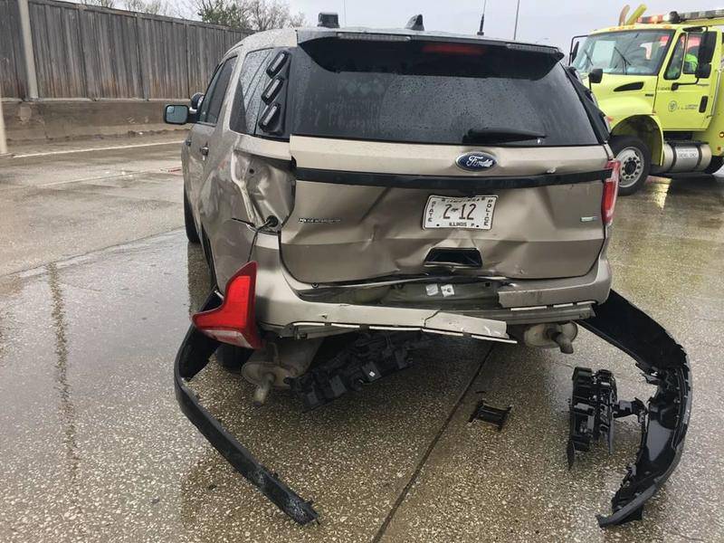 A Illinois State Police trooper was injured Saturday when his squad was struck while he was parked at the scene of a crash on Interstate 290 east of York Road near Elmhurst. Photo provided