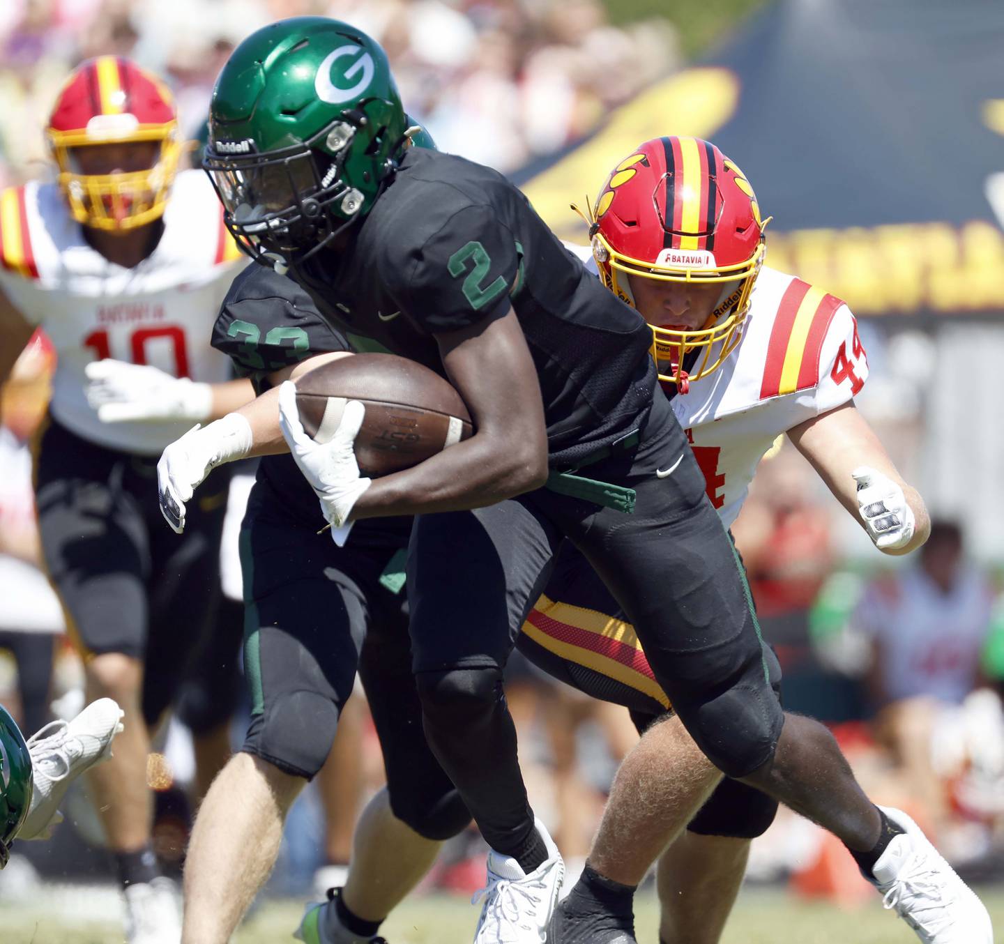 Batavia's Jake Feller (44) prepares to wrap up Glenbard West's Teyion Oriental (2) Saturday, Aug. 31, 2024 at Duchon Field in Glen Ellyn.