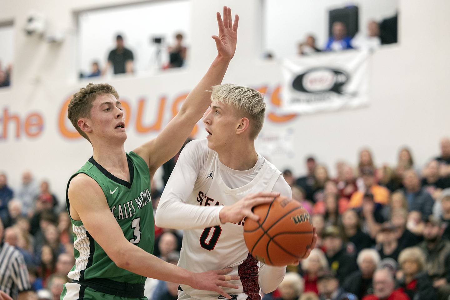 Fulton’s Baylen Damhoff looks to pass while being guarded by Scales Mound’s Thomas Hereau Friday, March 3, 2023 in the 1A sectional final in Lanark.