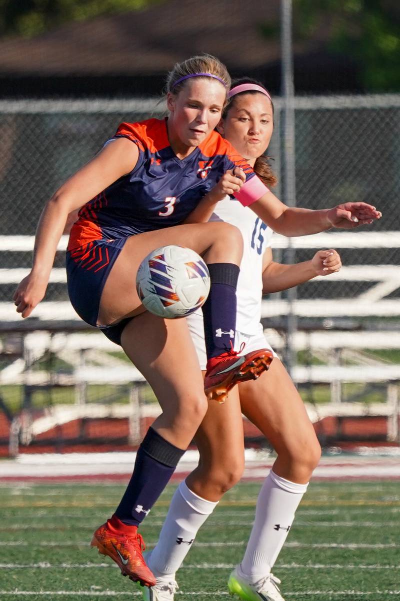Oswego’s Gillian Young (3) plays the ball against Oswego East's Lana Bomstad (15) during a Class 3A Lockport Regional semifinal soccer match at Lockport High School in Lockport on Wednesday, May 15, 2024.