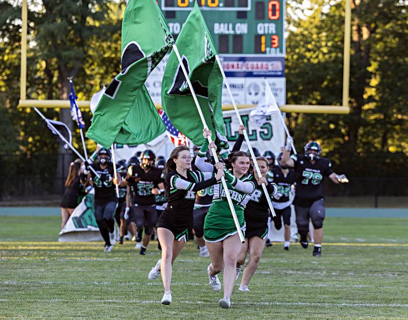 The Rock Falls color guard leads the football team onto their home field Thursday, August 31, 2023 in their game against Stillman Valley.