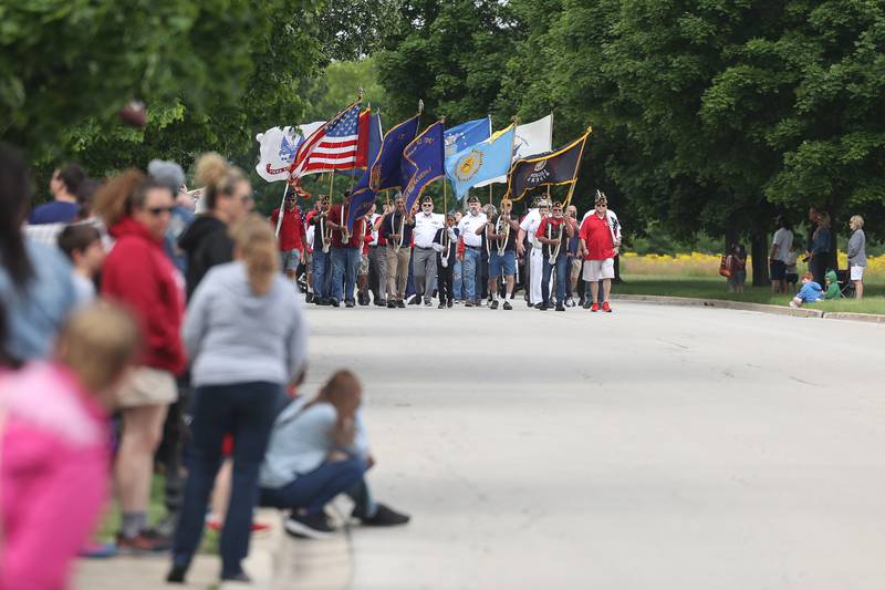 Veterans of the armed forces carry the flags to lead the parade at Plainfield’s Memorial Day and Ceremony event on Monday, May 27, 2024.