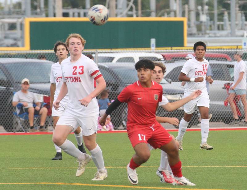 Ottawa's Evan Snook and L-P's Alex Rax wait fot the ball to drop in front of them on Wednesday, Sept. 18, 2024 at the L-P Athletic Complex in La Salle.