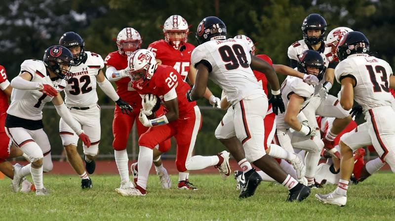 South Elgin's DeAngelo McCullough (26) moves the ball upfield against Barrington Friday, Aug. 30, 2024 in South Elgin.