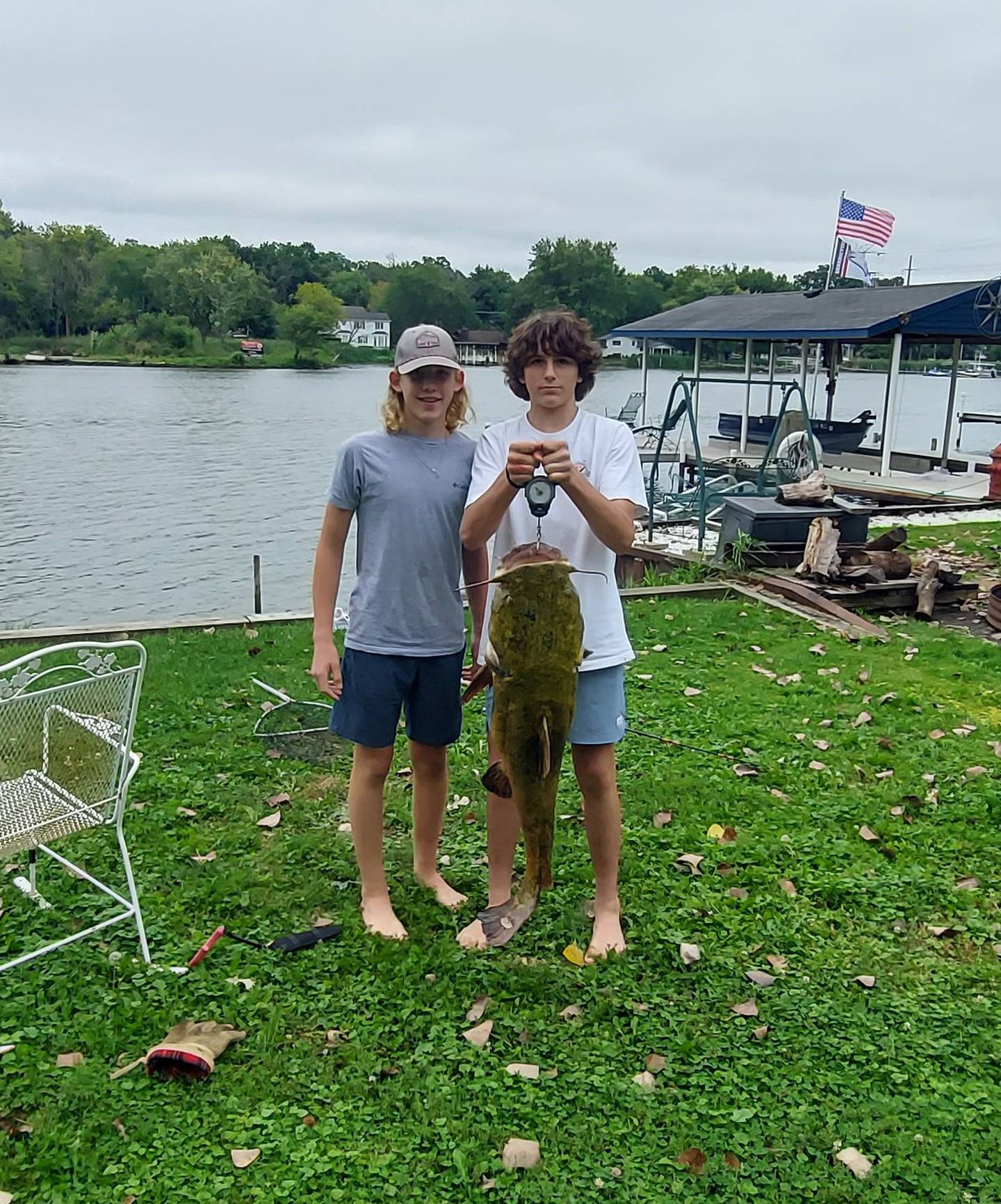 Norman, and his friend, pose with the catfish.