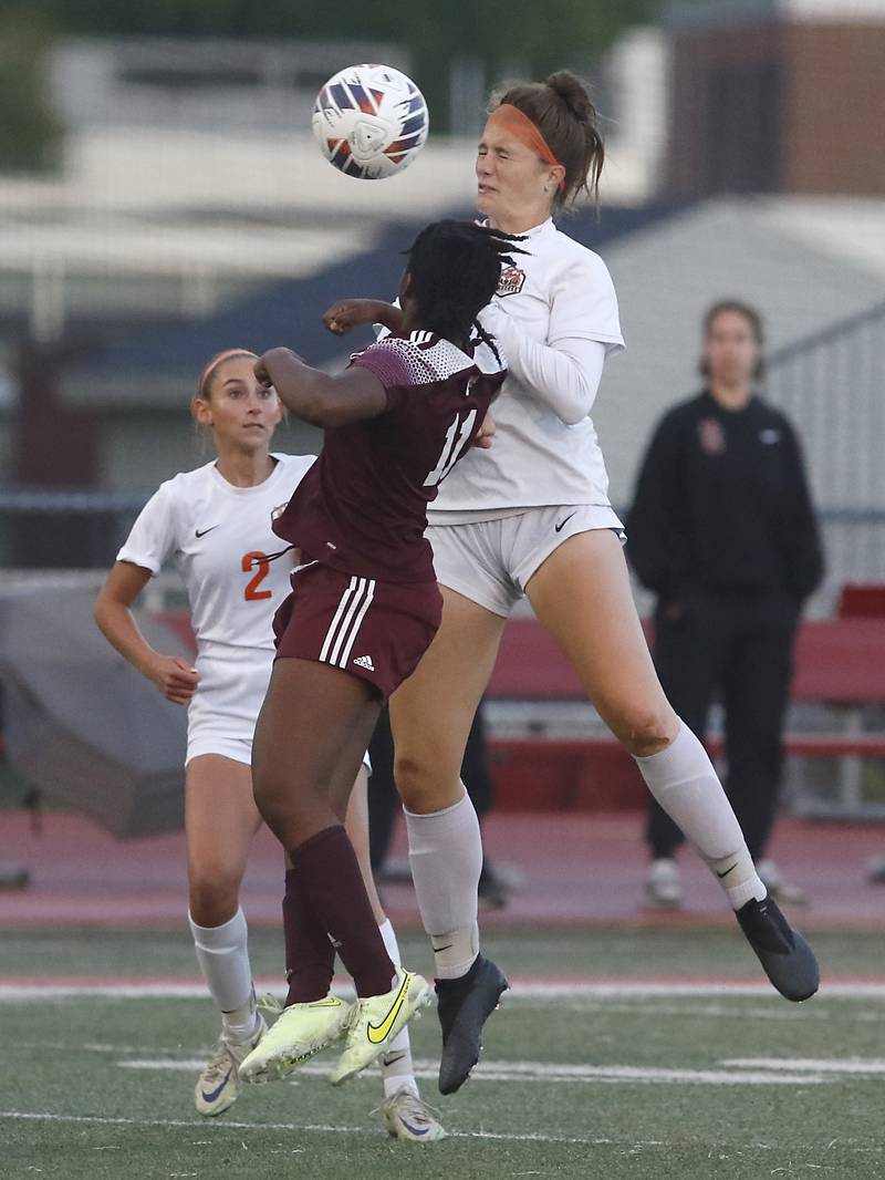 Crystal Lake Central's Shaylee Gough heads the ball away from St. Ignatius College Prep's Kayla Washington during the Class 2A Deerfield Supersectional girls soccer match on Tuesday, May 28, 2024, at Deerfield High School.