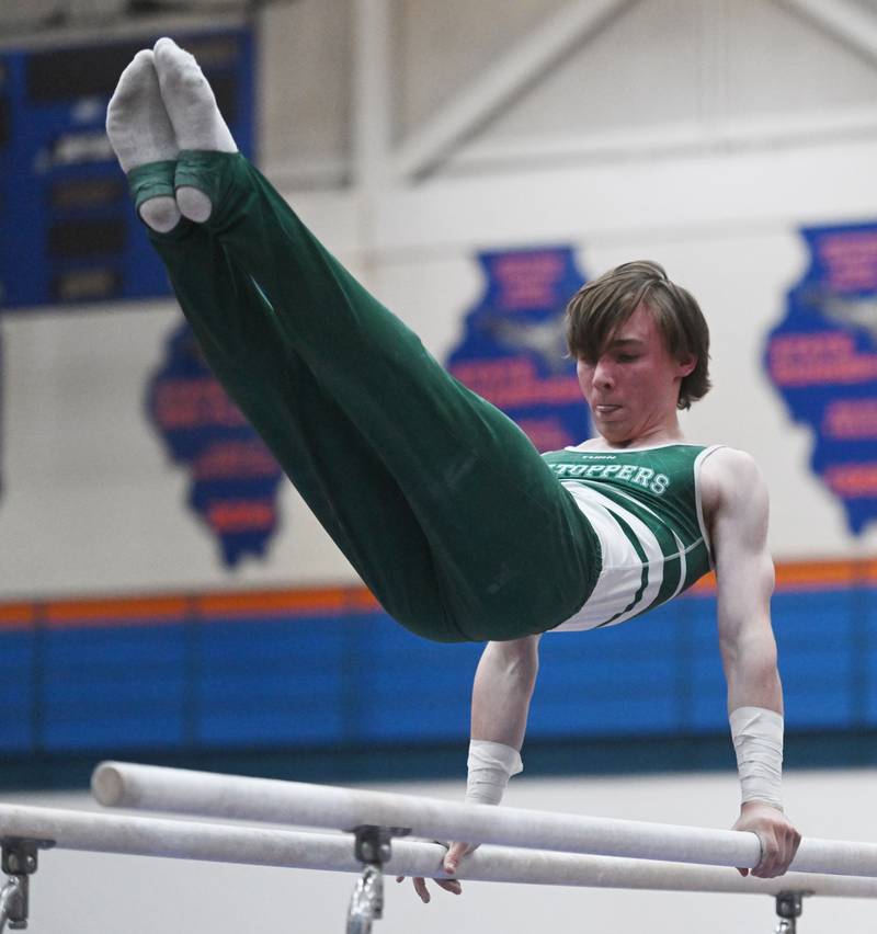 Glenbard West’s John Mammoser competes on parallel bars during the boys state gymnastics meet at Hoffman Estates High School on Saturday, May 11, 2024 in Hoffman Estates.