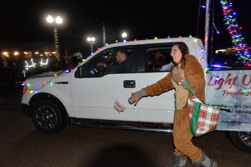 Walking "reindeers" with Prophetstown's Light Up the Park gave out glow sticks to the crowd during the Erie Hometown Holidays Lighted Parade on Saturday, Dec. 2, 2023.
