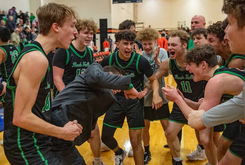 Rock Falls head coach Zach Sandrock celebrates with his team after beating Byron 43-40 to win the 2A Byron Regional championship game on Saturday, Feb. 25, 2023.