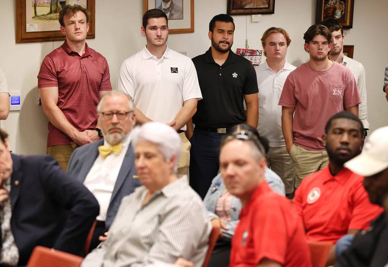 Members of the Northern Illinois University Greek community listen as DeKalb City Manager Bill Nicklas speaks Monday, July 10, 2023, during the DeKalb City Council meeting recommending the council pass a resolution to enter into a redevelopment agreement with the NIU Foundation for the development of the NIU Center for Greek Life at West Hillcrest Drive and Blackhawk Road.