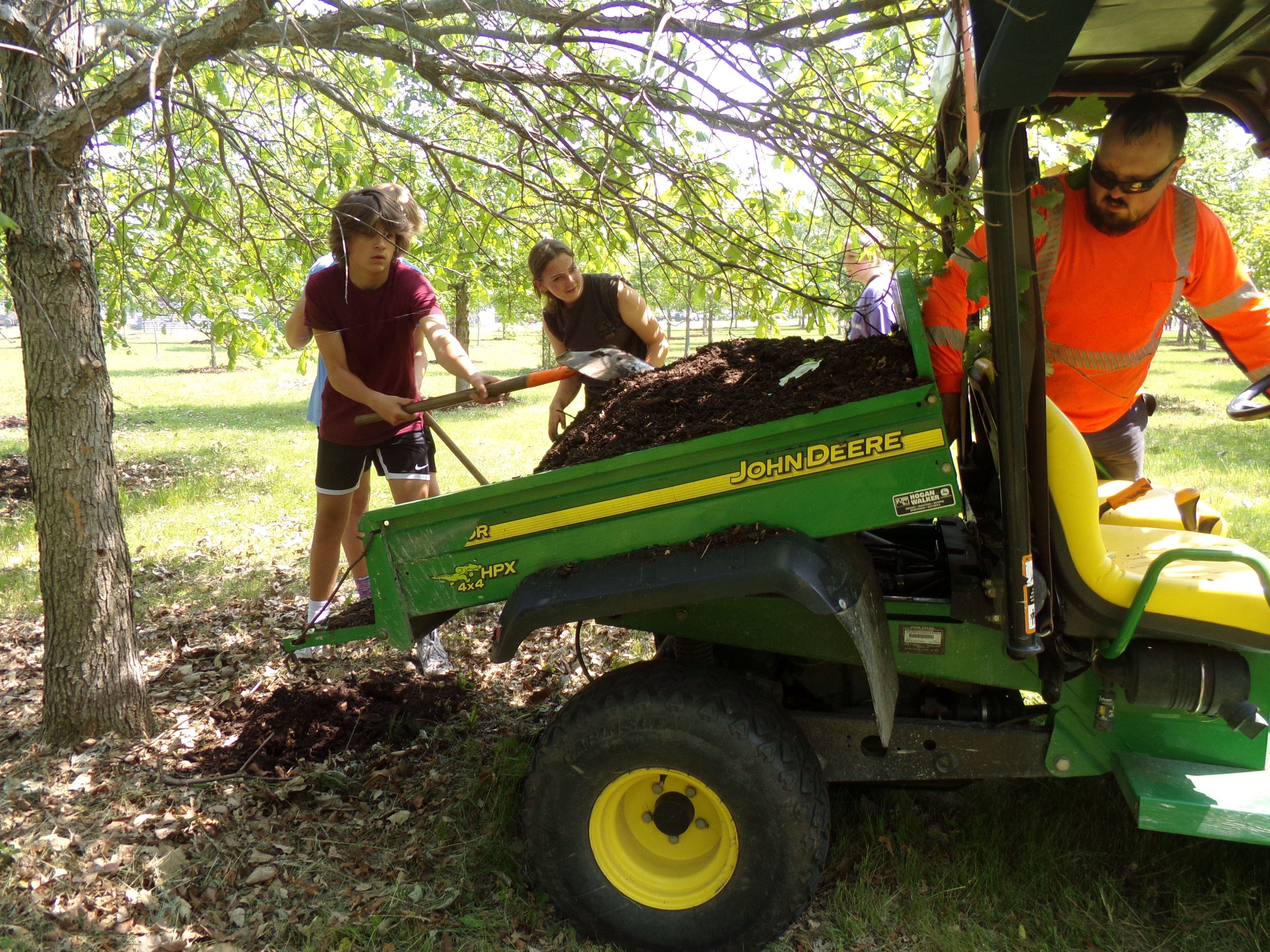 Six laborers from Laborers Union Local 393 helped Milton Pope students spread mulch Wednesday, May 24, 2023, at the Illinois Fallen Soldiers Tree Memorial at Illini State Park in Marseilles.