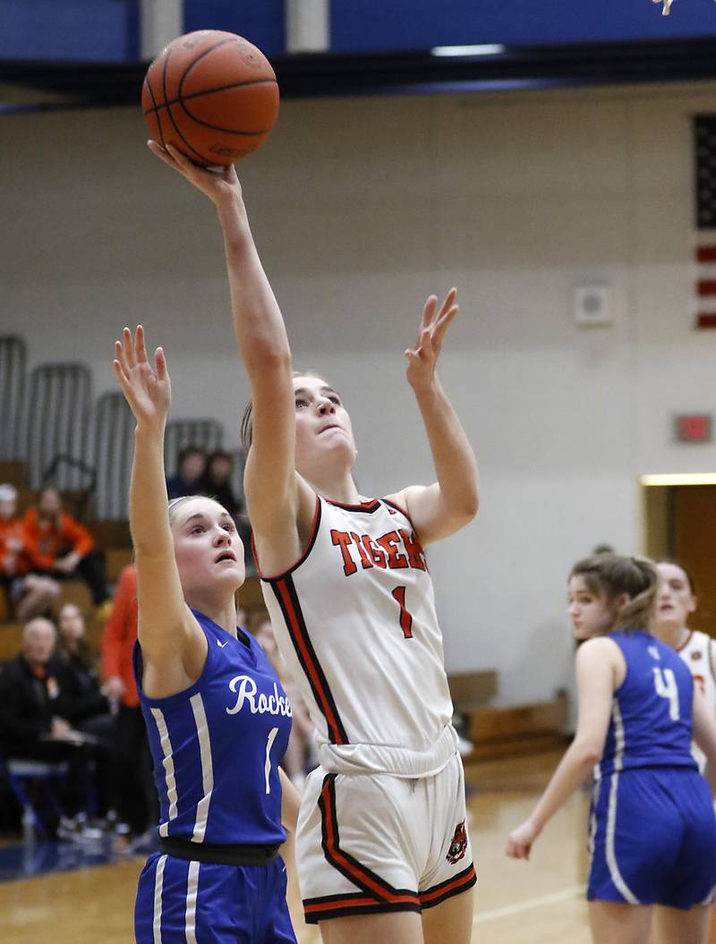 Crystal Lake Central's Ruby Macke drives to the basket against Burlington Central's Kenzie Andersen during the IHSA Class 3A Woodstock Regional Championship Girls basketball games on Thursday, Feb. 15, 2024, at Woodstock High School.