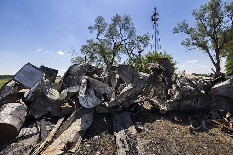 Crumpled metal from the haunted house’s “Clown Room” sits piled up Thursday, May 23, 2024 after being scooped from the remains of the barn.