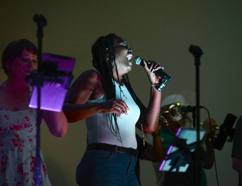 Brass from the Past's Regina Rhymes of Chicago sings at the opening night of the  Jamboree music series in downtown Mt. Morris on Friday, June 7, 2024. The free concert series continues through the summer each Friday night on the campus.