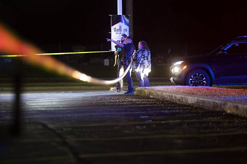 Investigators work at the scene of a shooting Tuesday, May 28, 2024, in the 2200 block of East Lincolnway in Sterling.