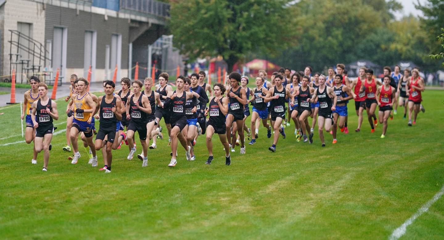 The runners take to the course during the boys varsity Dukane Conference Cross Country Championships at Lake Park High School in Roselle on Saturday, Oct. 14, 2023.