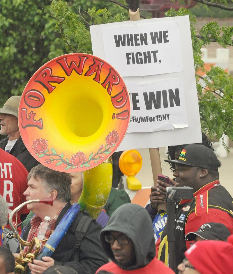 Protesters demonstrate May 20 outside McDonald's corporate headquarters in Oak Brook for a $15 an hour minimum wage. Protesters from around the country, including New York and Detroit, are in town for the McDonald's shareholder meeting on May 21.