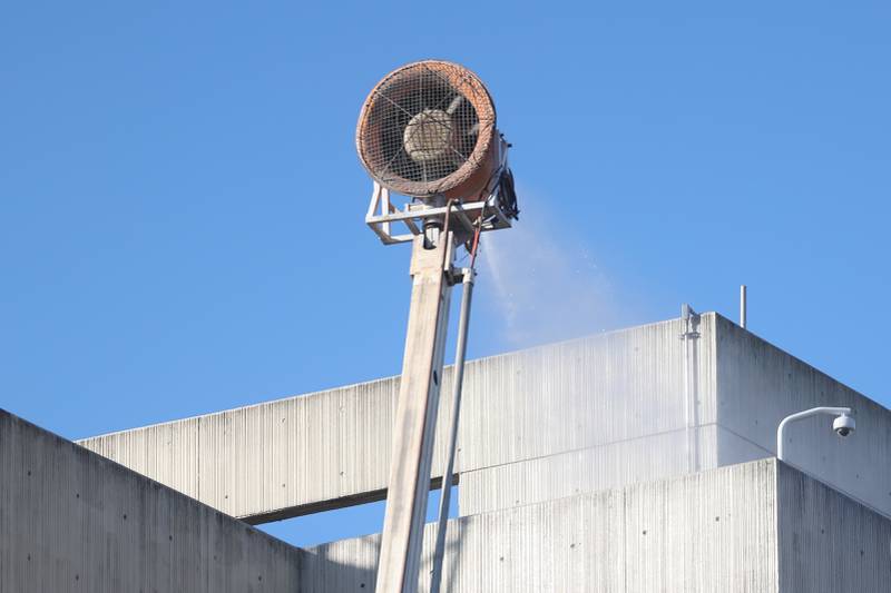 Water is sprayed on the old Will County Courthouse to reduce dust during the external demolition on Friday, Feb. 9th 2024 in Joliet.