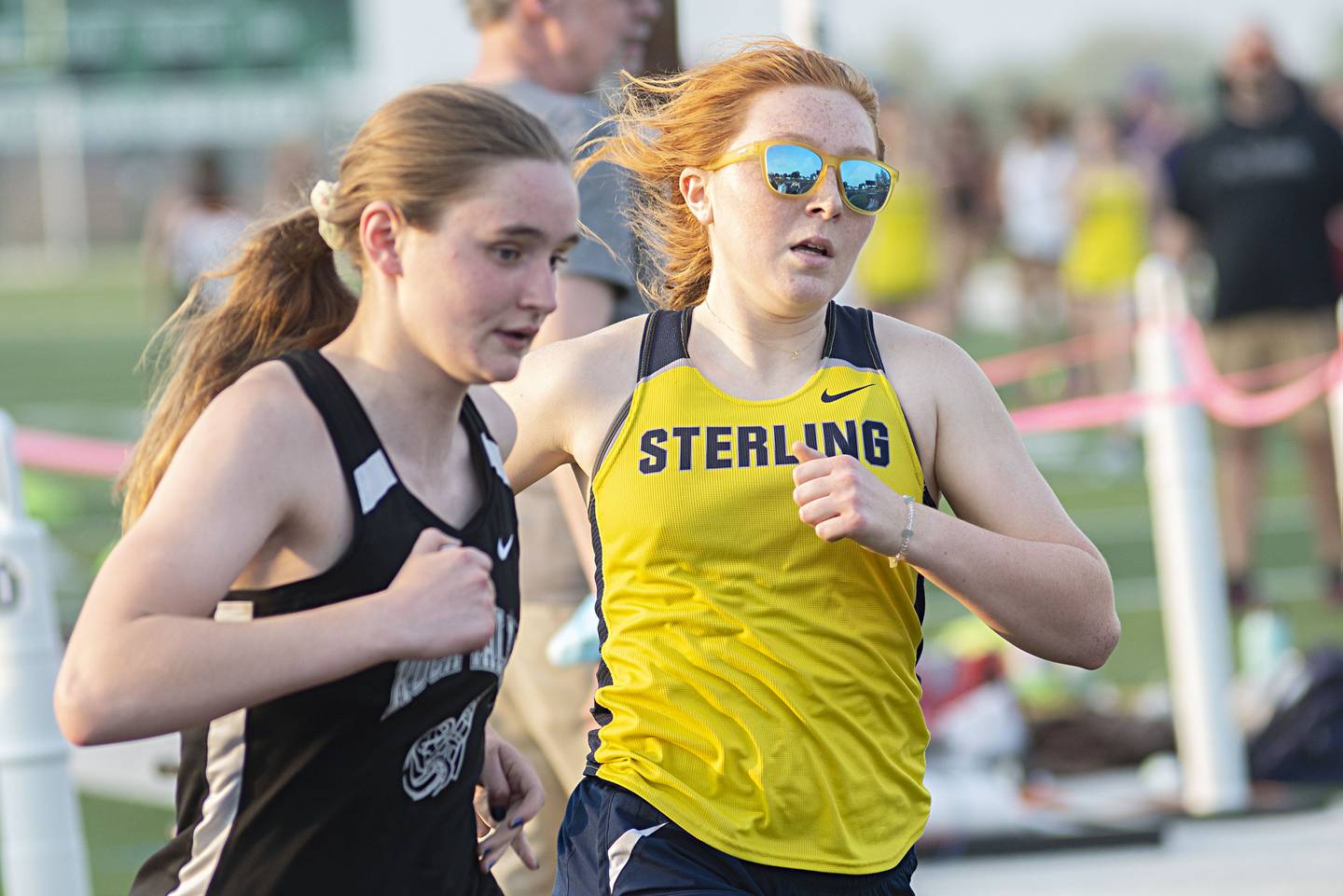 Rock Falls' Tayli Hultin (left) and Sterling's Kylie Nicklaus run in the 800 at the 2A track sectionals in Geneseo on Wednesday, May 11, 2022.