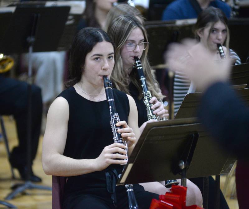 Sonya Plescia plays the clarinet as watches band director Andy Eckardt during Oregon High School's Christmas Concert on Sunday, Dec. 17, 2023. The afternoon event was held in the OHS Music Room and also included performances by the OHS Choir.