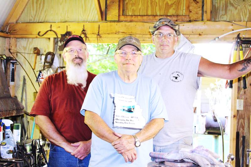 Blacksmithing is alive and well in Whiteside County, thanks to a trio of enthusiasts who enjoy playing with fire and pounding away at projects: Daryl Drennen (center) of Prophetstown, his son Patrick (left) of Erie, and Rob "Ike" Isaacson of Morrison.