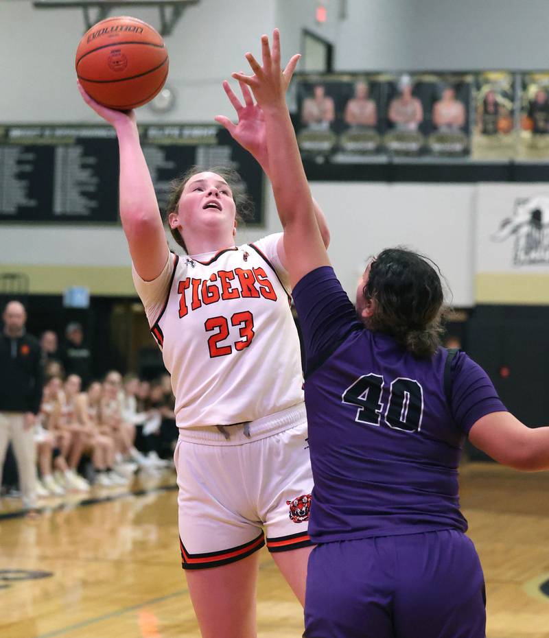 Crystal Lake Central's Leah Spychala shoots over Dixon’s Hallie Williamson during their Class 3A sectional semifinal Tuesday, Feb. 20, 2024, at Sycamore High School.