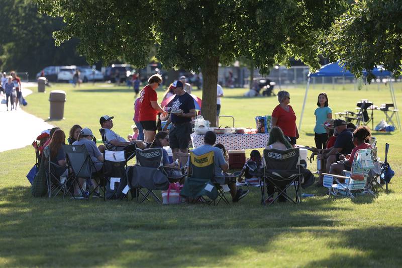 A large group sets up camp before the fireworks at Dellwood Park in Lockport on Wednesday July 3, 2024.