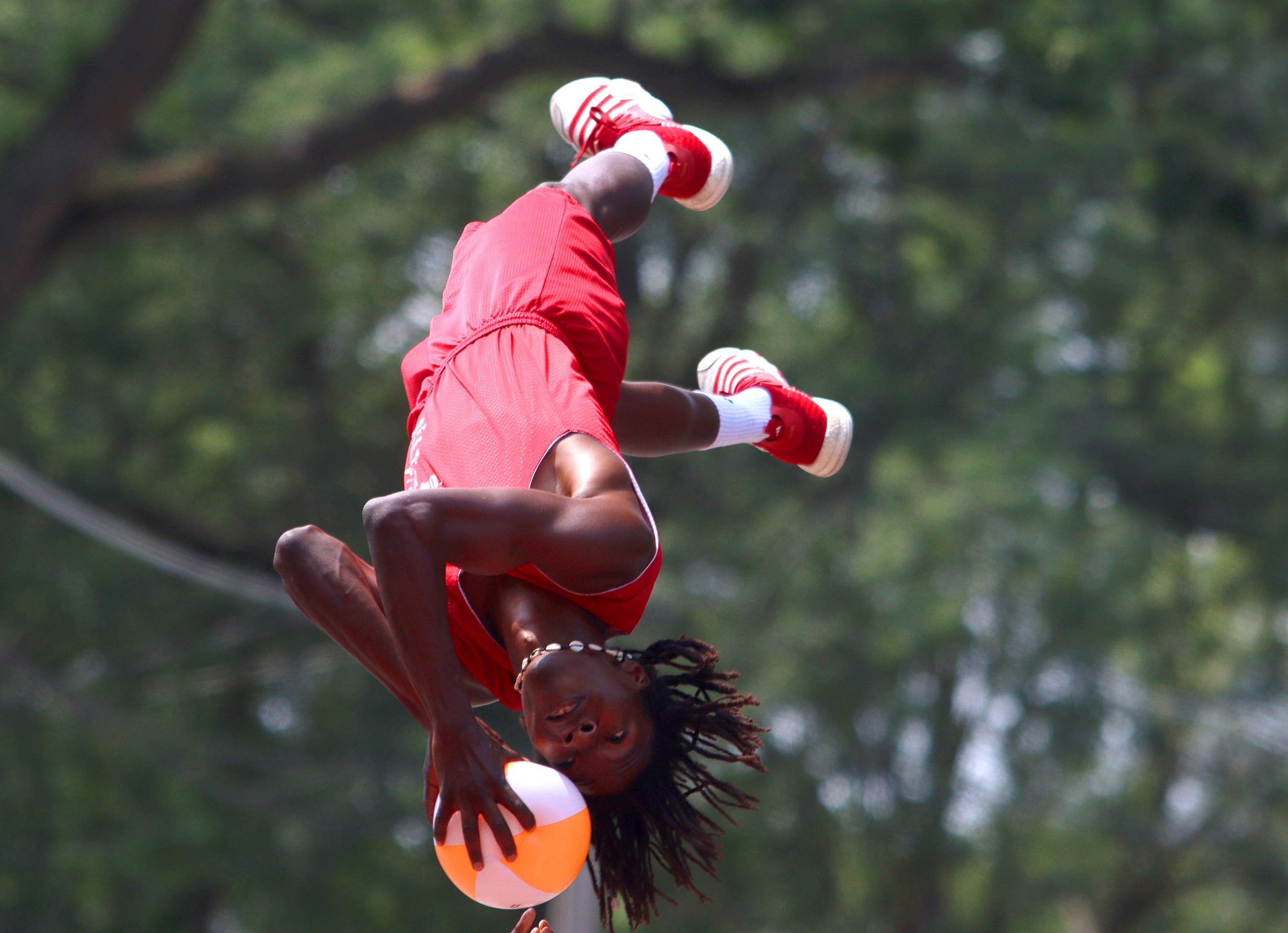 The Jesse White tumblers perform as part of the Fiesta Days parade along Main Street in McHenry Sunday.