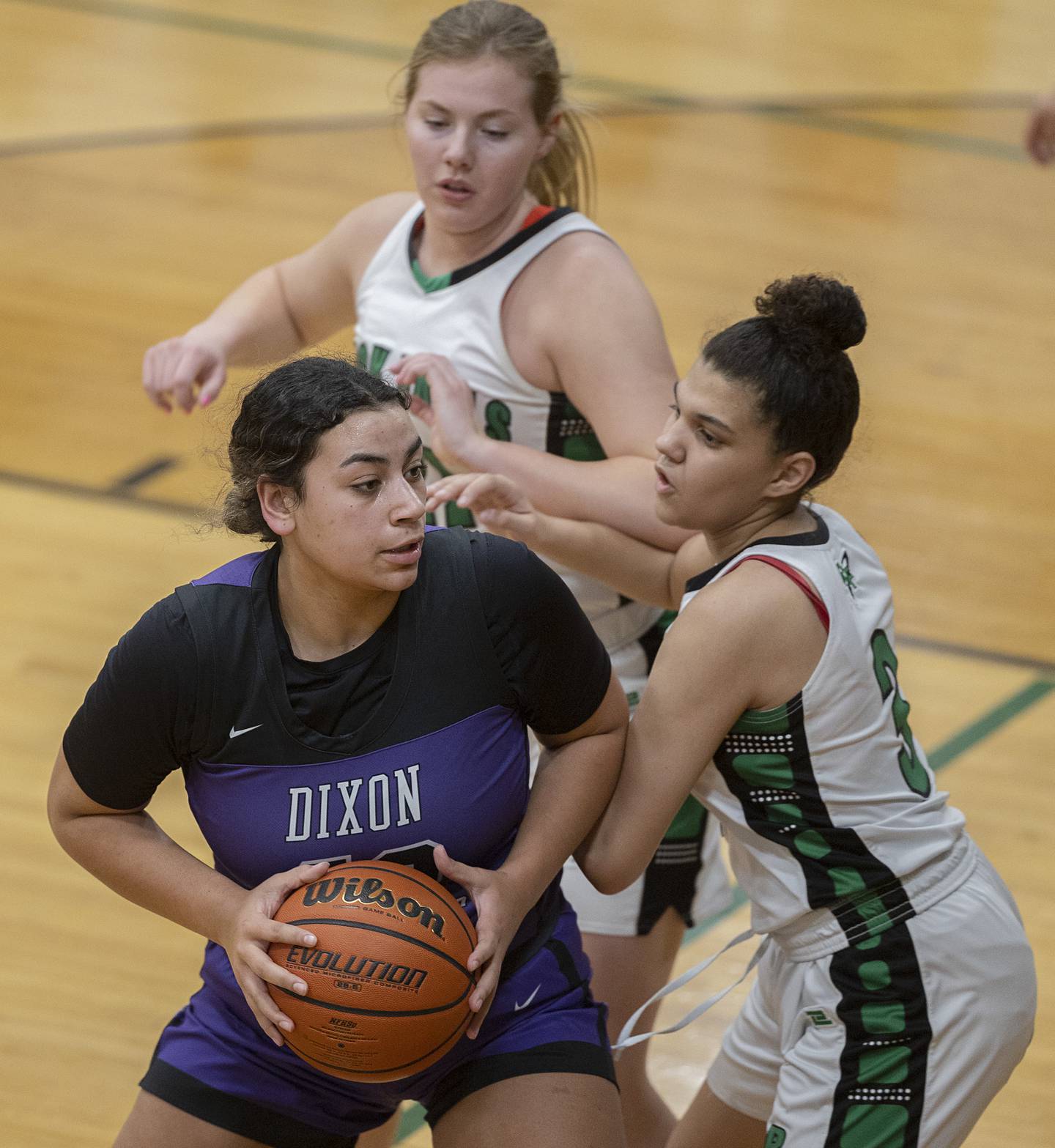 Dixon’s Hallie Williamson works against Rock Falls’ Autumn Weatherby Wednesday, Jan. 31, 2024 at Rock Falls High School.