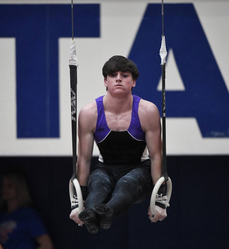 Downers Grove North’s Parker Elisha on the still rings at the State Boys Gymnastics All Around competition at Hoffman Estates High School on Friday, May 13, 2022.