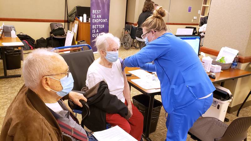 Vivian Anderson celebrates her 89th birthday getting a COVID-19 vaccine at Northwestern Medicine Kishwaukee Hospital with husband John Anderson