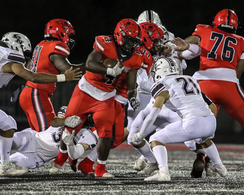 Bolingbrook's Timmie Lewis II (4) runs with the ball during a football game between Plainfield North at Bolingbrook on Friday, Oct 18th, 2024  in Bolingbrook.