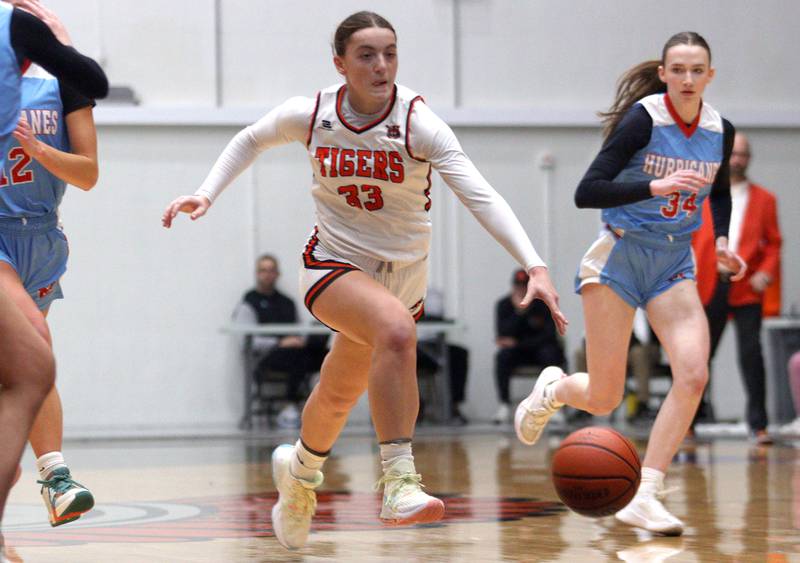 Crystal Lake Central’s Kathryn Hamill races down the court against Marian Central in Northern Illinois Holiday Classic championship girls basketball game action at  McHenry High School Thursday.