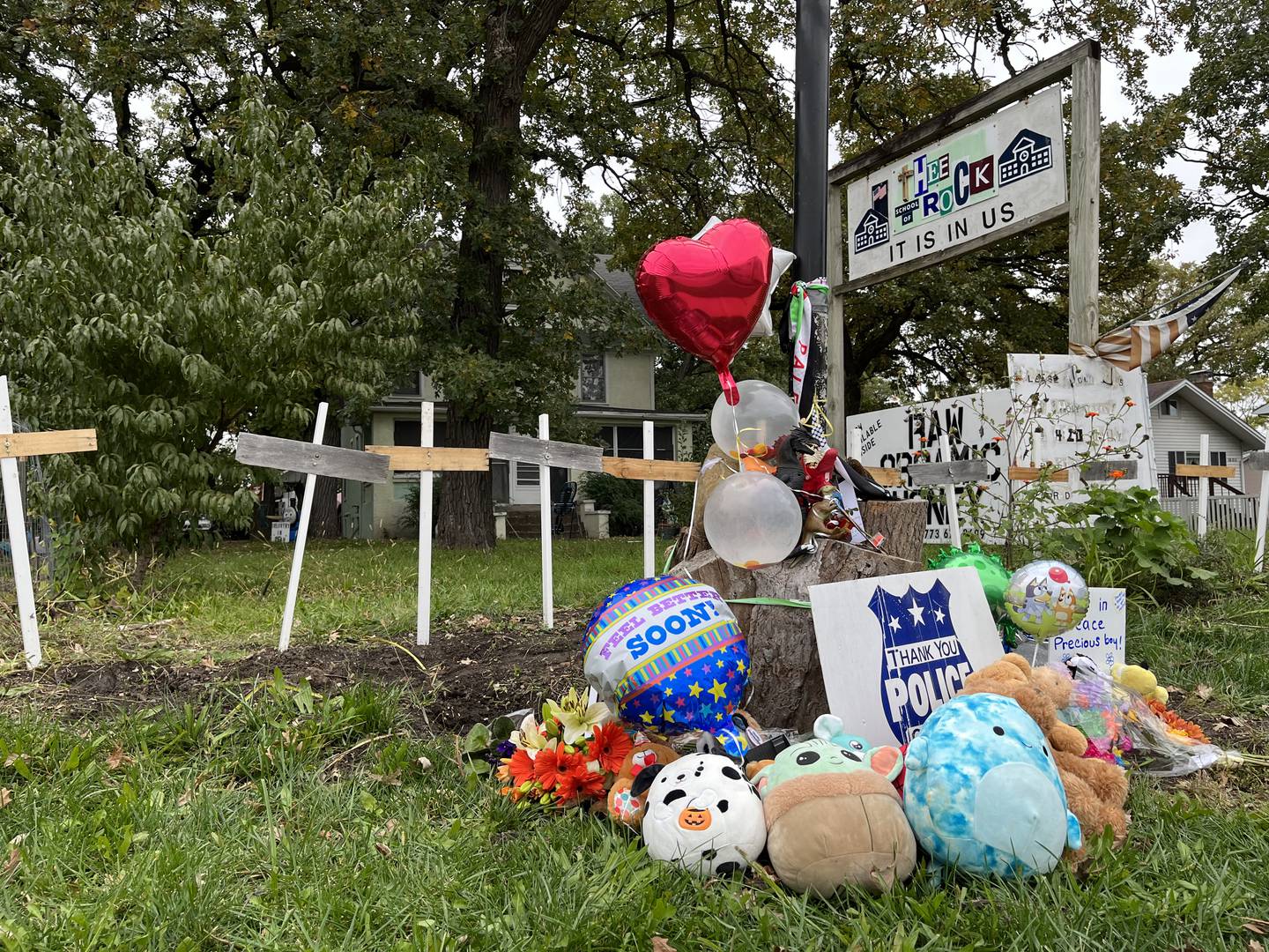 A small memorial of balloons and toys outside of a Plainfield Township residence where a 6-year-old victim was stabbed to death on Oct. 14, 2023. The boy's mother was also attacked as well but survived. Joseph Czuba, 71, has been charged with the first-degree murder of the boy and attempted first-degree murder of the mother.